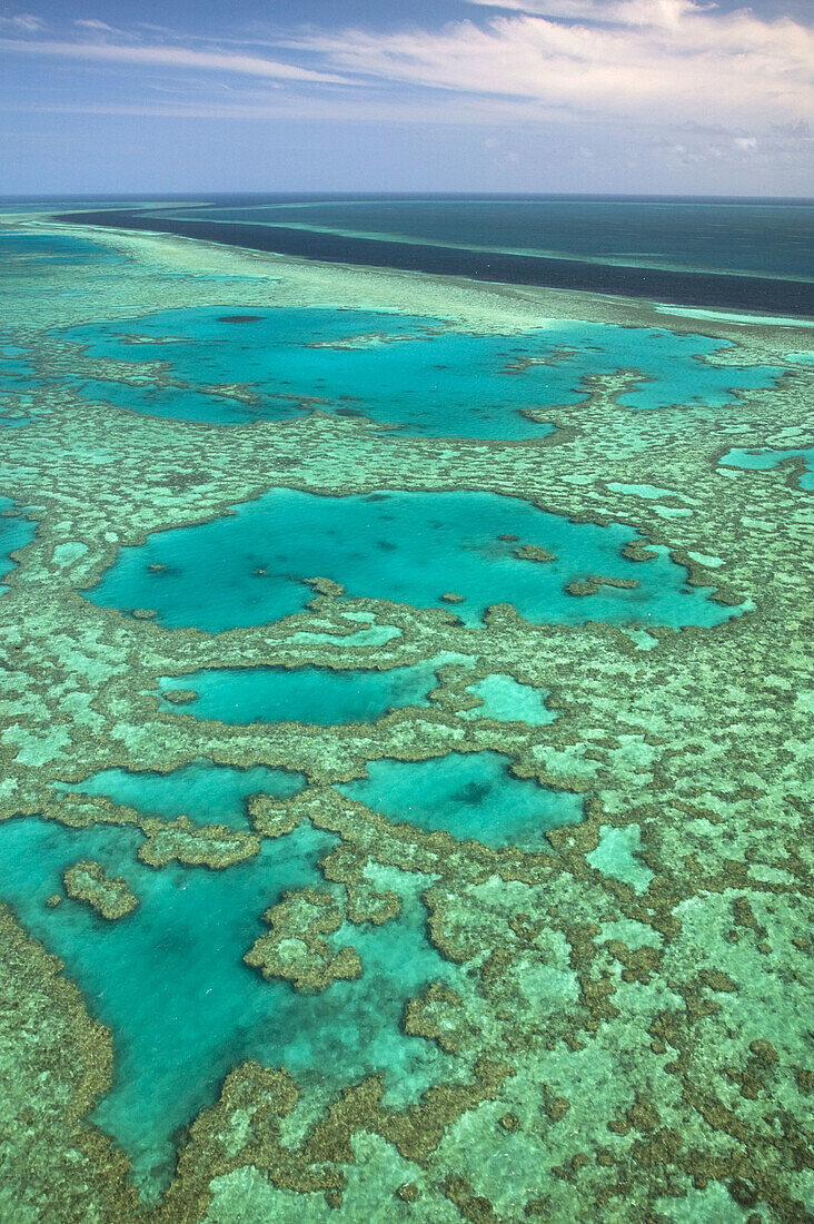 AUSTRALIA - Queensland - WHITSUNDAY COAST - Great Barrier Reef: Aerial of the Great Barrier Reef by the Whitsunday Coast with its ´River´