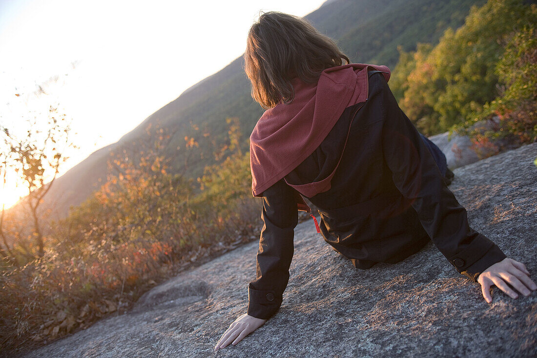 Young woman sitting,  Bear Mountain State Park,  New York State,  USA