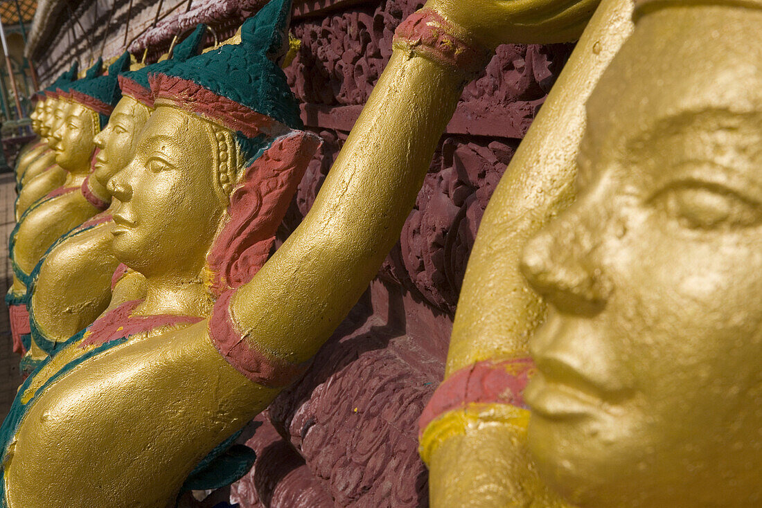 Golden figures at a buddhistic temple, Phnom Penh, Cambodia, Asia