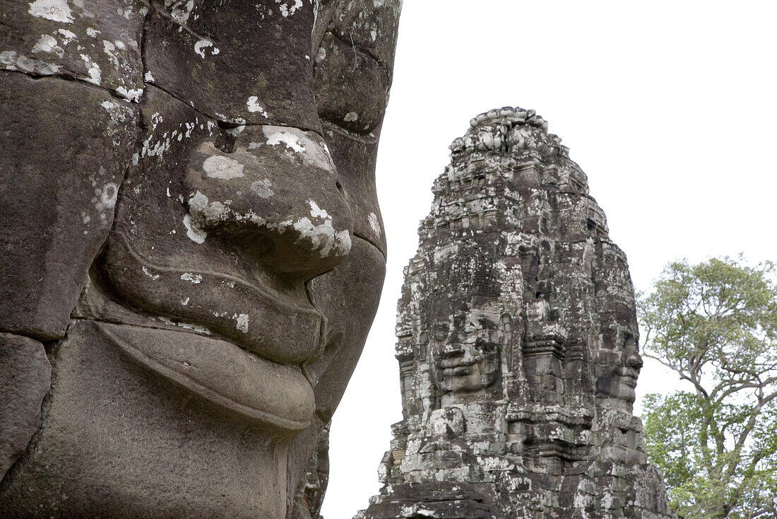 Stone faces of Bodhisattva Lokeshvara in the Bayon temple at Angkor, Siem Reap Province, Cambodia, Asia