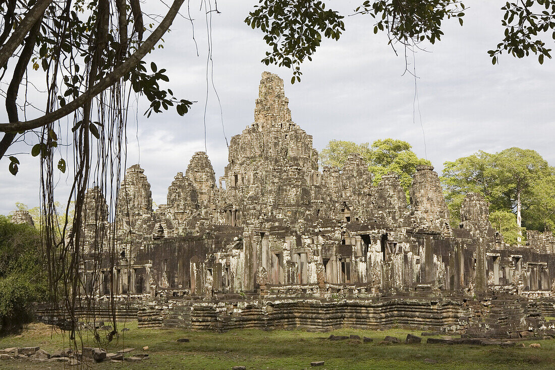 Bayon Temple at Angkor under clouded sky, Siem Reap Province, Cambodia, Asia