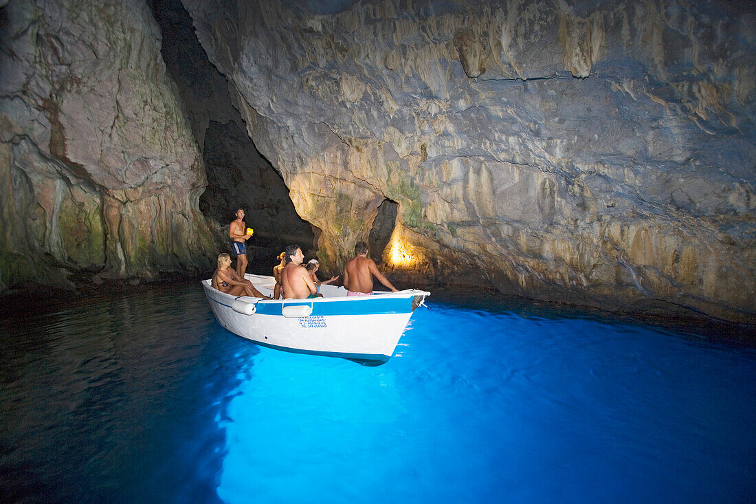 Tourists in the blue grotto, Cape Palinuro, Cilento, Campania, Italy