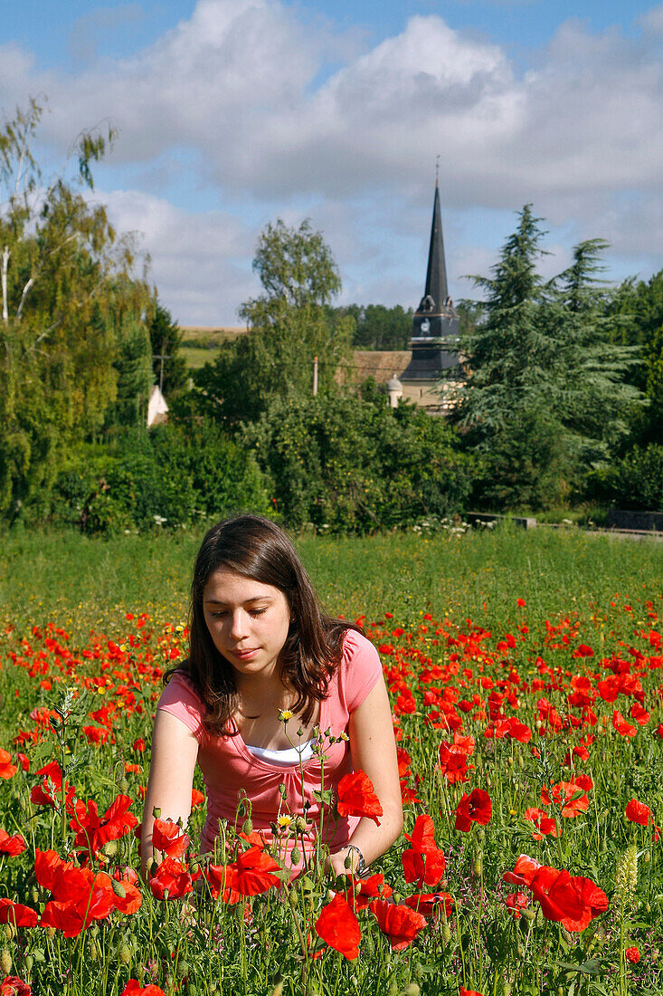 Young Girl With Poppies, Gathering Flowers In Front Of The Church In The Village Of Rouvres, Eure-Et-Loir (28), France