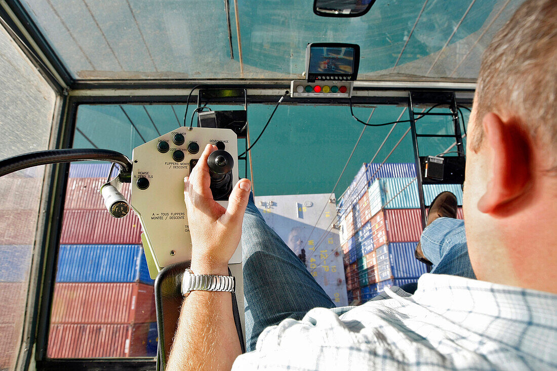 Docker Working On A Loading Gantry, Loading Of Containers Onto A Cargo Boat, Terminal Of France Port 2000, Commercial Port, Le Havre, Normandy, France