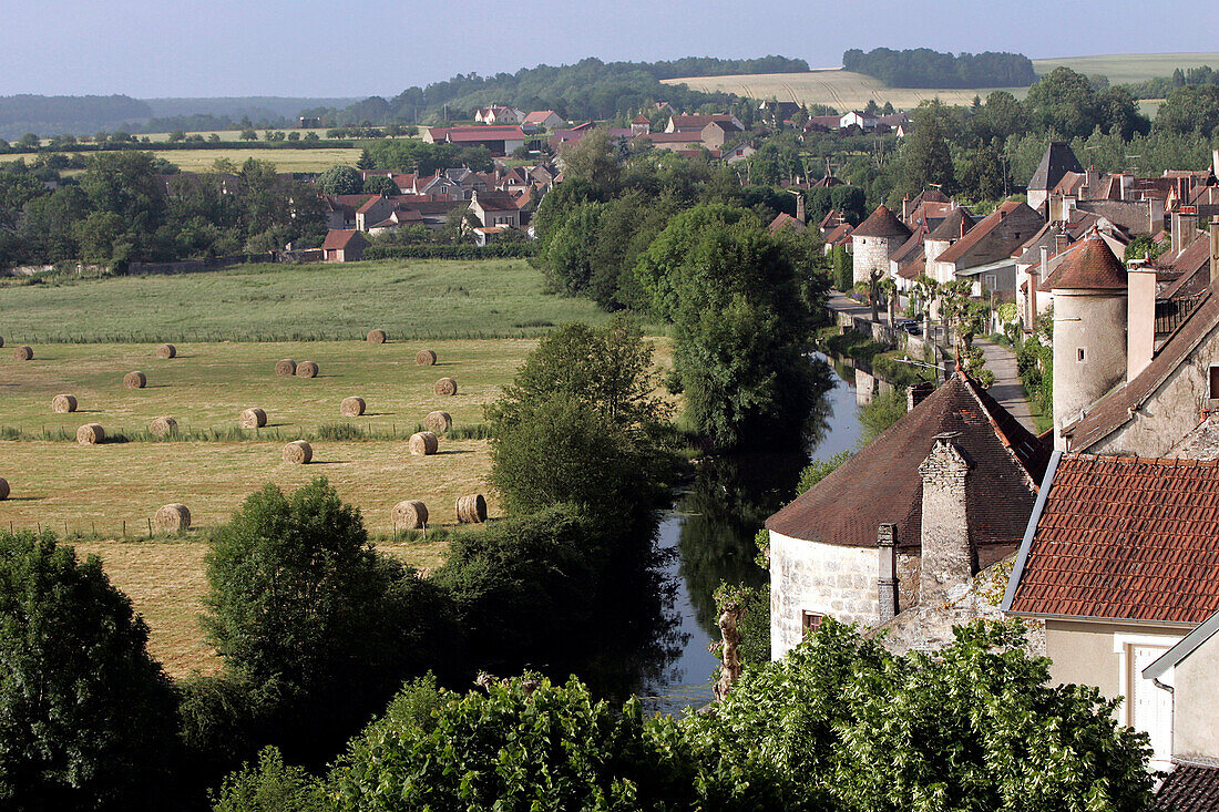 Village And Bale Of Straw In A Field, Noyers-Sur-Serein Yonne (89), Burgundy, France