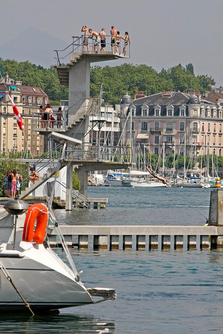 Bathing And Relaxing At The Diving Board Of The Bains Des Paquis In The Geneva Harbour On Lake Geneva, Switzerland