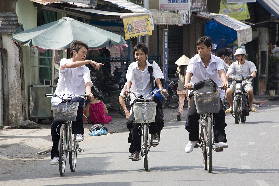School boys on their bicycles at Can Tho, Mekong Delta, Can Tho Province, Vietnam, Asia