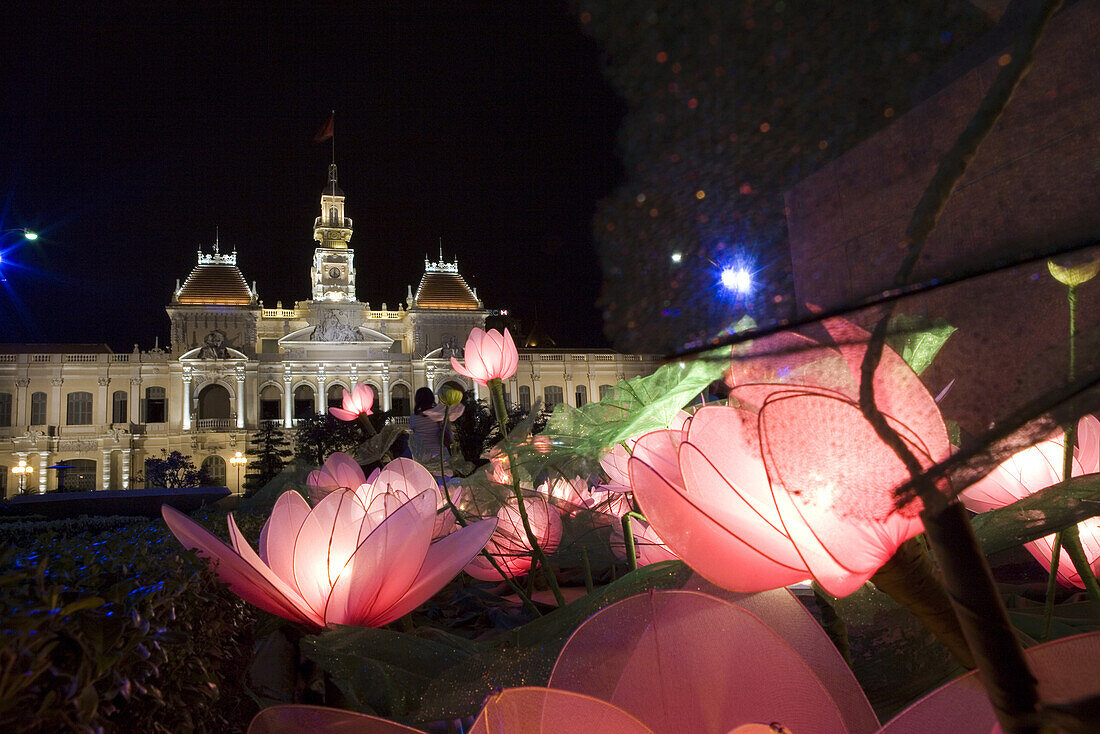 Town hall, illuminated flowers in front of the city hall downtown Saigon, Hoh Chi Minh City, Vietnam, Asia