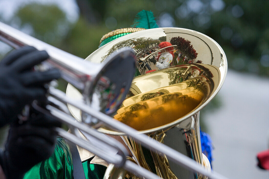 Reflection of the carnival procession on a trombone during Childrens Carnival, Funchal, Madeira, Portugal