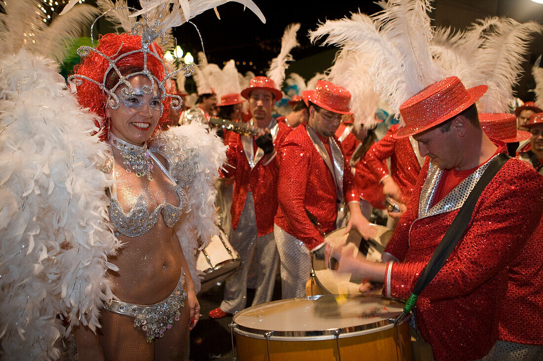 People in colorful costumes at the Carnival Parade, Funchal, Madeira, Portugal