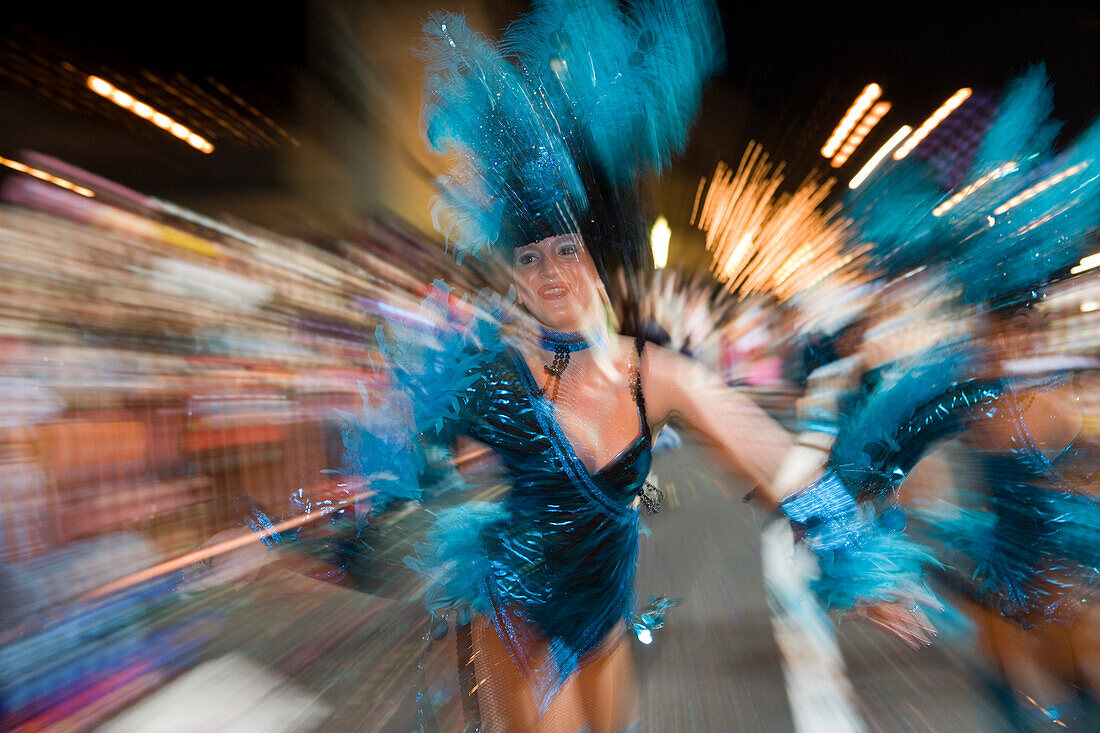 Women in colourful costumes at the Carnival Parade, Funchal, Madeira, Portugal