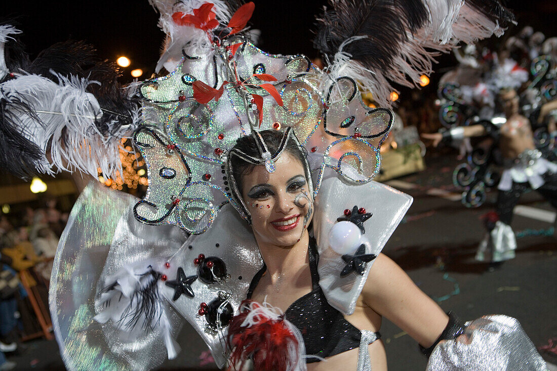 Woman in colourful costume at the Carnival Parade, Funchal, Madeira, Portugal