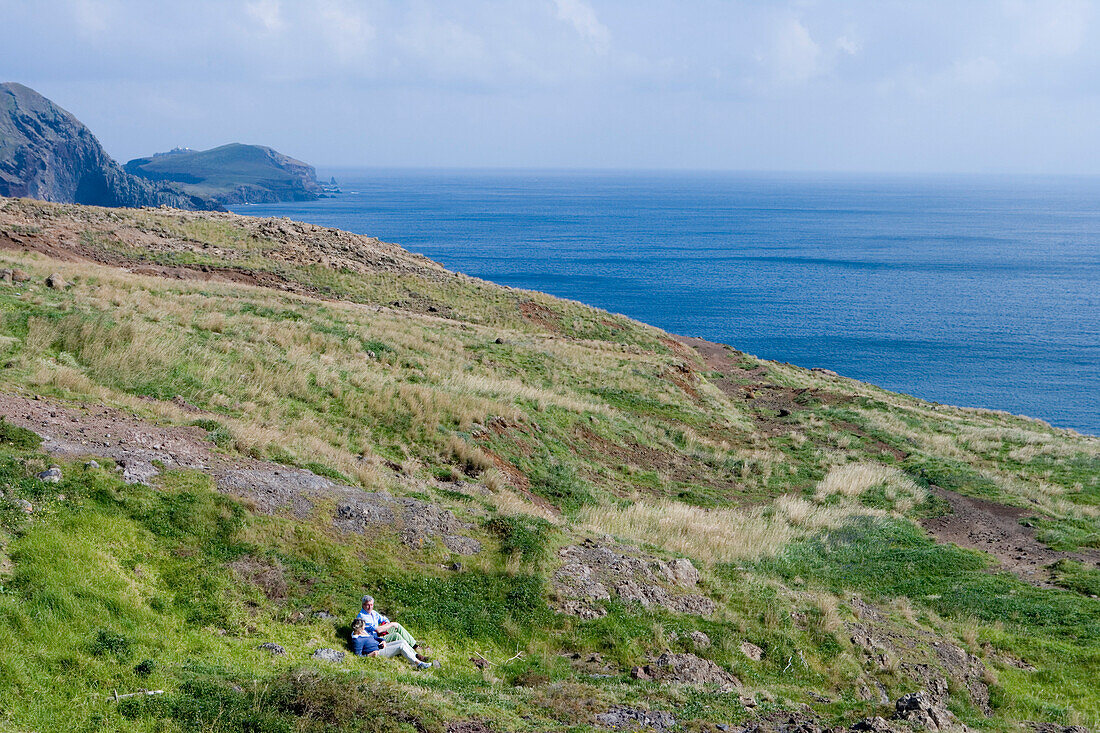 Hikers relaxing on a walk to Ponta de Sao Laurenco, Near Canical, Madeira, Portugal