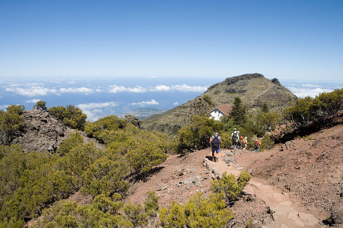 Hikers descend from Summit of Pico Ruivo Mountain, Pico Ruivo, Madeira, Portugal