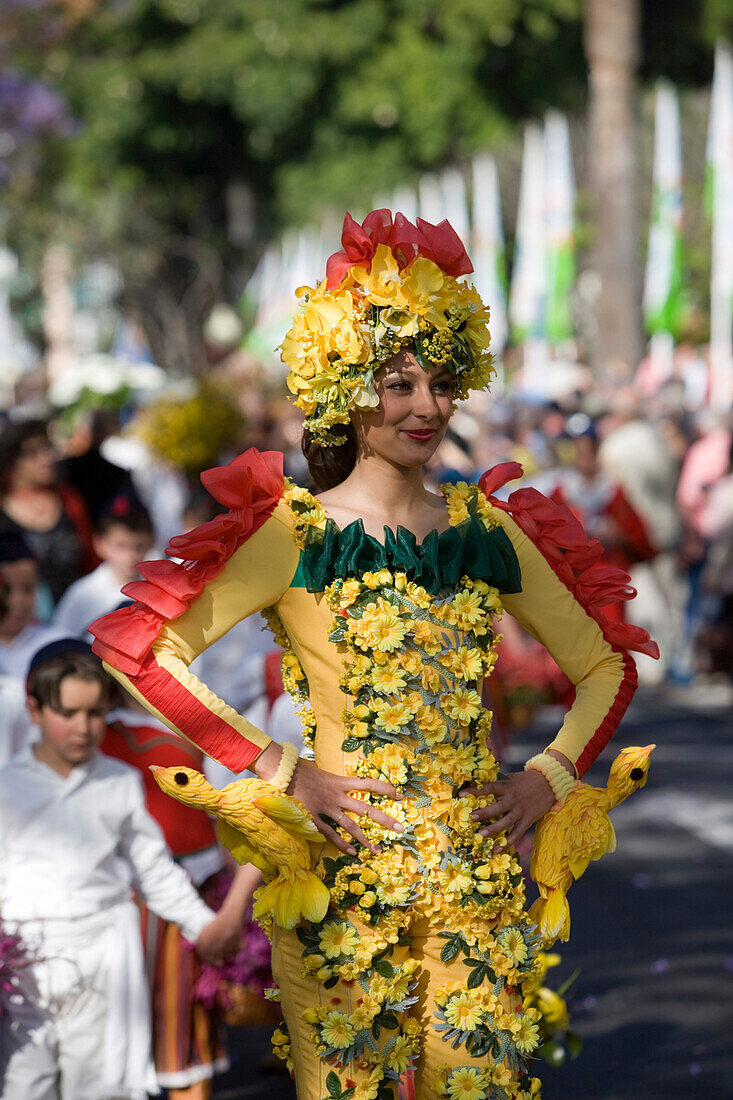Woman in a floral costume at the Flower Festival Parade, Funchal, Madeira, Portugal