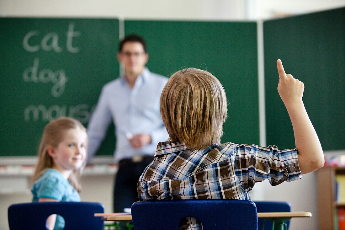 Pupils and teacher in classroom, Hamburg, Germany