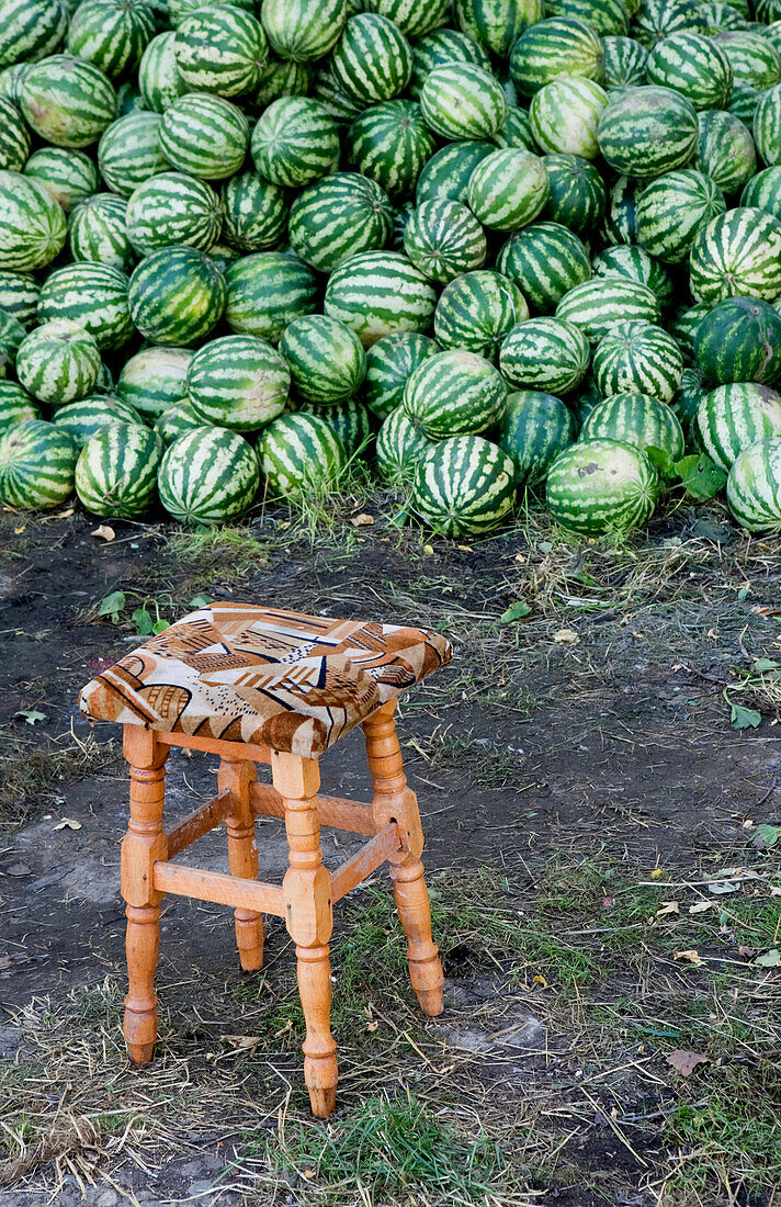 Watermelons and stool on the road side, Transylvania, Carpathian Mountains, Romania, Europe