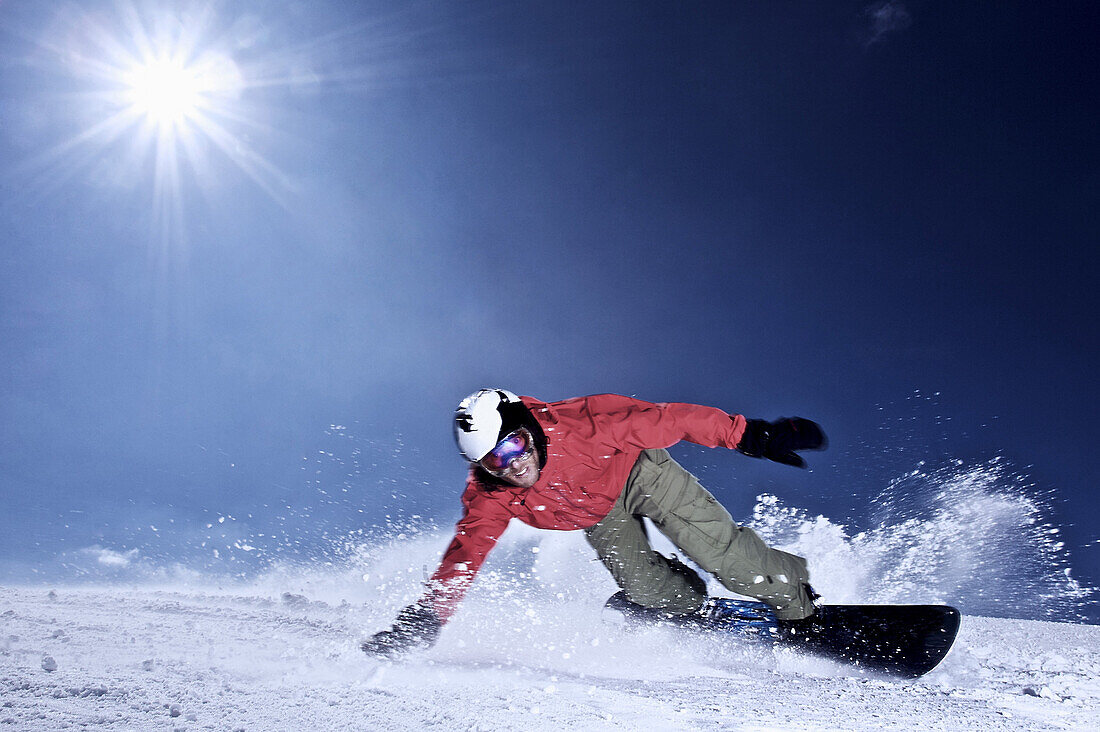 Snowboarder on slope, Kappl, Tyrol, Austria