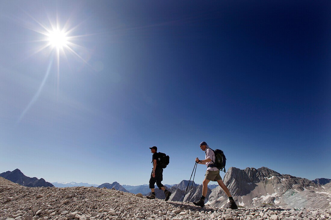 Two hikers on Zugspitzplatt, Wetterstein range, Bavaria, Germany