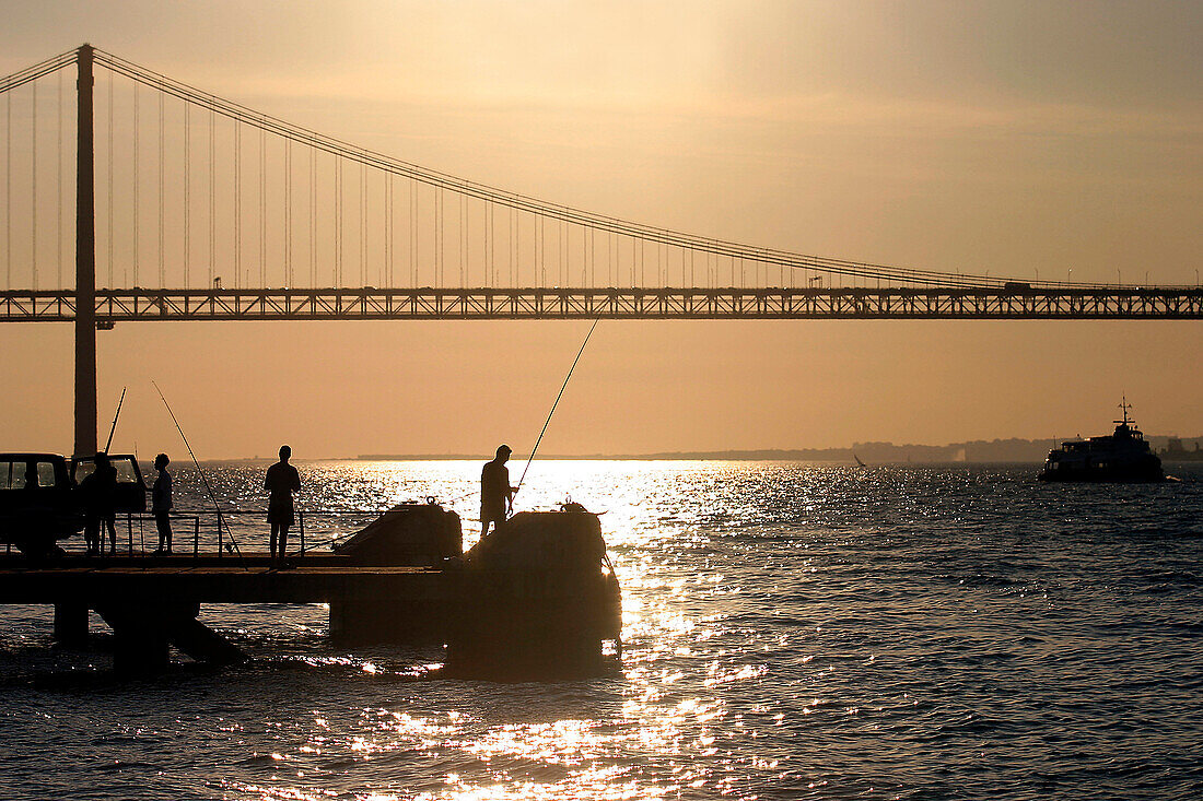 Fishermen Near The 25Th Of April Bridge, Lisbon, Portugal