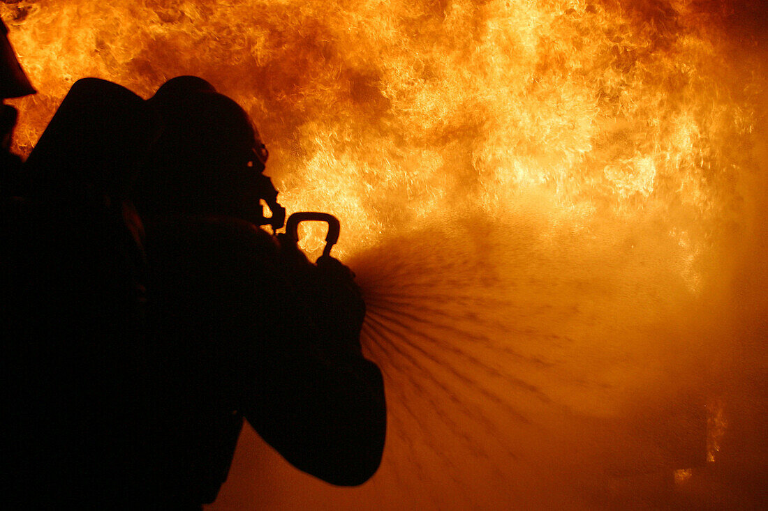 Firemen Undergoing Training In Fire Fighting, Simulation Of An Industrial Fire, Ifopse, Nivillac, Morbihan (56), France
