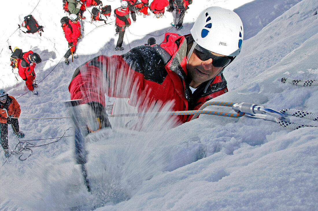 Climbing An Ice Cascade With Crampons And Ice Axes. Survival Training For Helicopter Pilots Of The Civil Emergency Services Supervised By The Fire Department, La Meije Lagrave, Hautes-Alpes (05), France