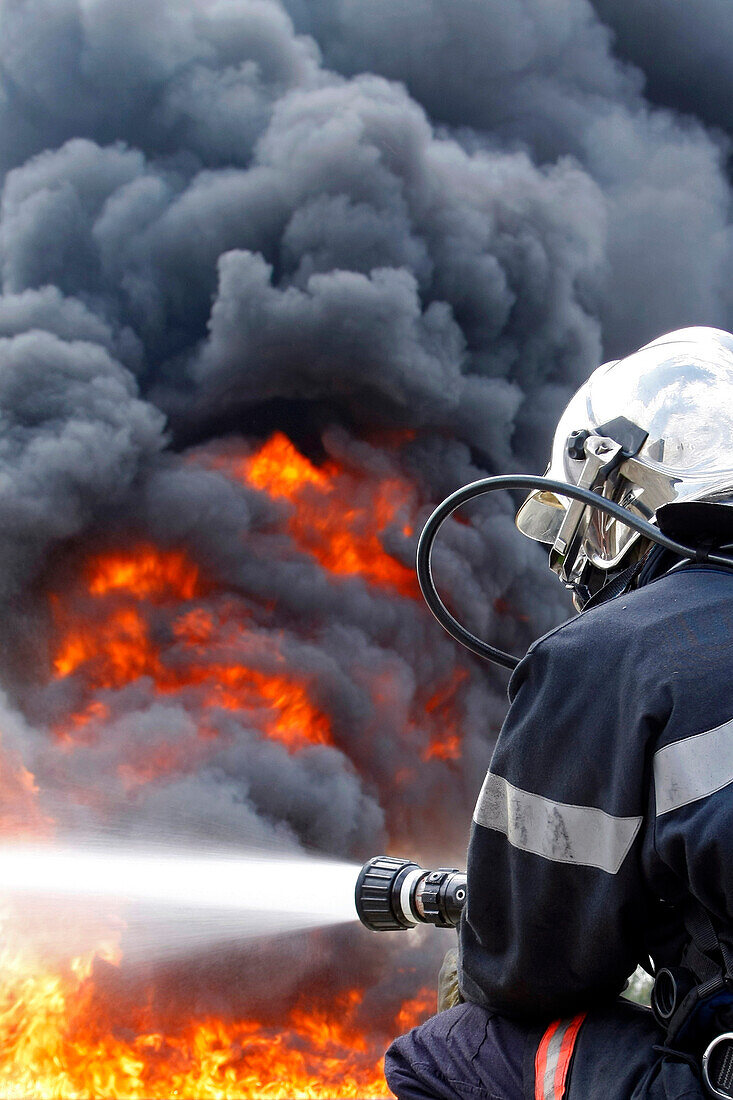 Firefighters In Action, Training In The Extinguishing Of Hydrocarbon Fires, Departmental Firefighters School Of The Sdis61, Alencon, Orne (61), France