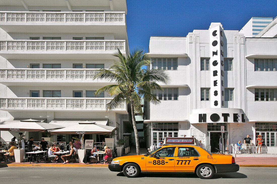 Yellow Taxi On Ocean Drive, Art Deco Neighborhood In Miami Beach, Miami, Florida, Usa