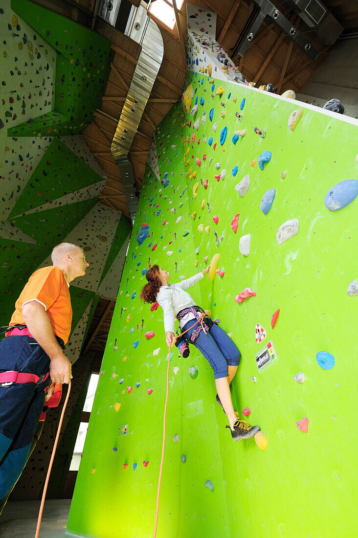 Woman climbing, Rosenheim, Upper Bavaria, Bavaria, Germany