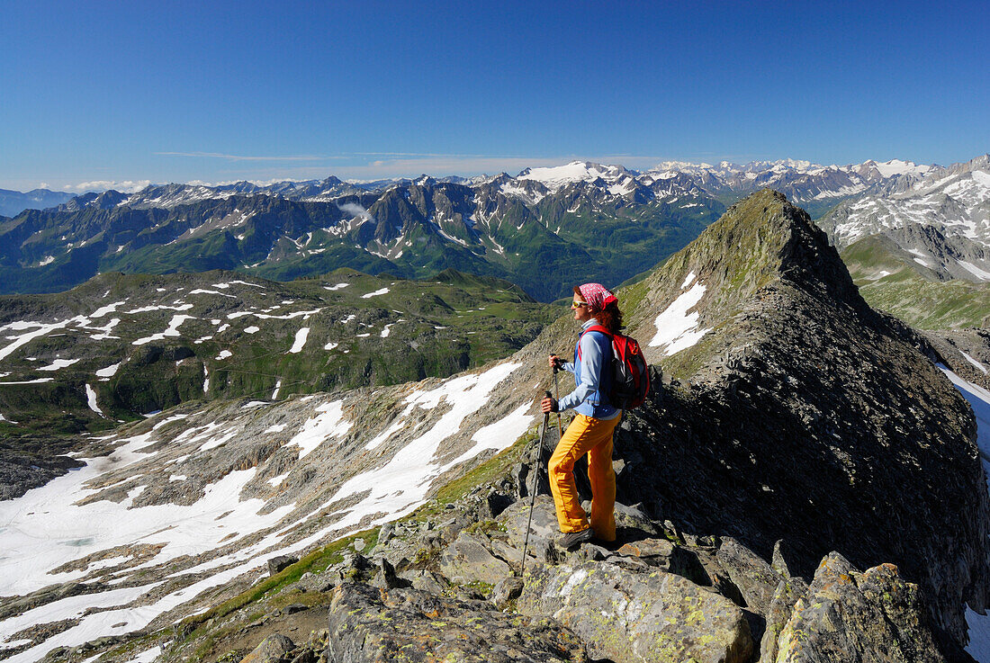 Woman enjoying view over Western Alps, Gotthard range, Canton of Ticino, Switzerland