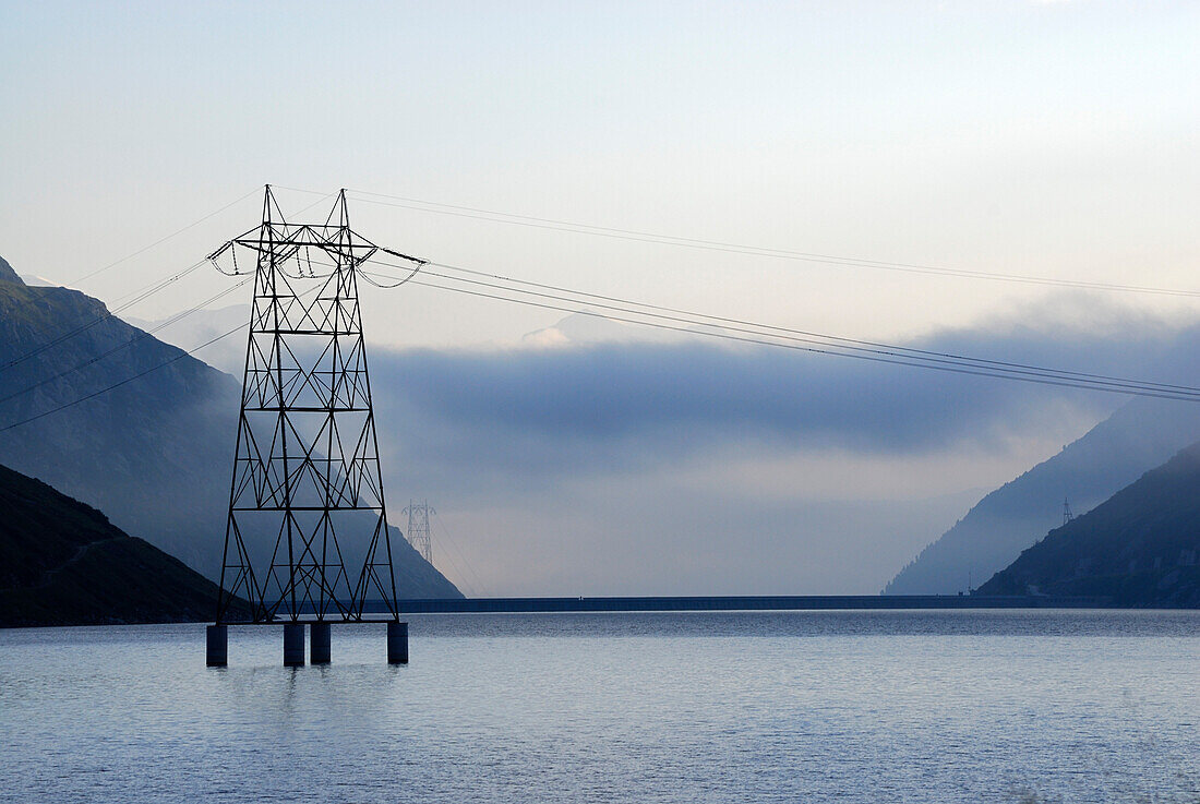 Electricity pylon in reservoir Lai da Sontga Maria, Lukmanier Pass, Adula Alps, Grisons, Switzerland