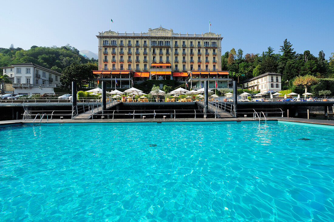 Swimming pool with hotel in background, Tremezzo, Lake Como, Lombardy, Italy