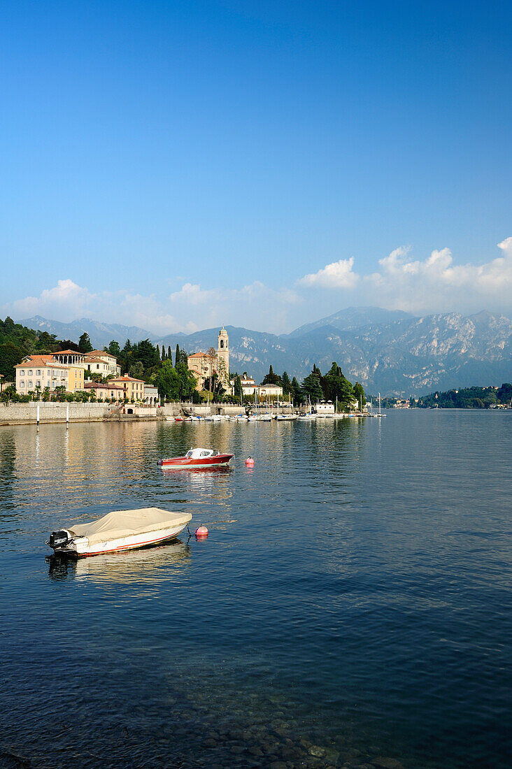 View over Lake Como to Tremezzo with Bergamo Alps in background, Lombardy, Italy