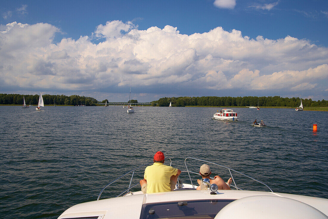 Houseboat and sailing boats on the Lake Dargin (Jezioro Dargin), Mazurskie Pojezierze, East Prussia, Poland, Europe