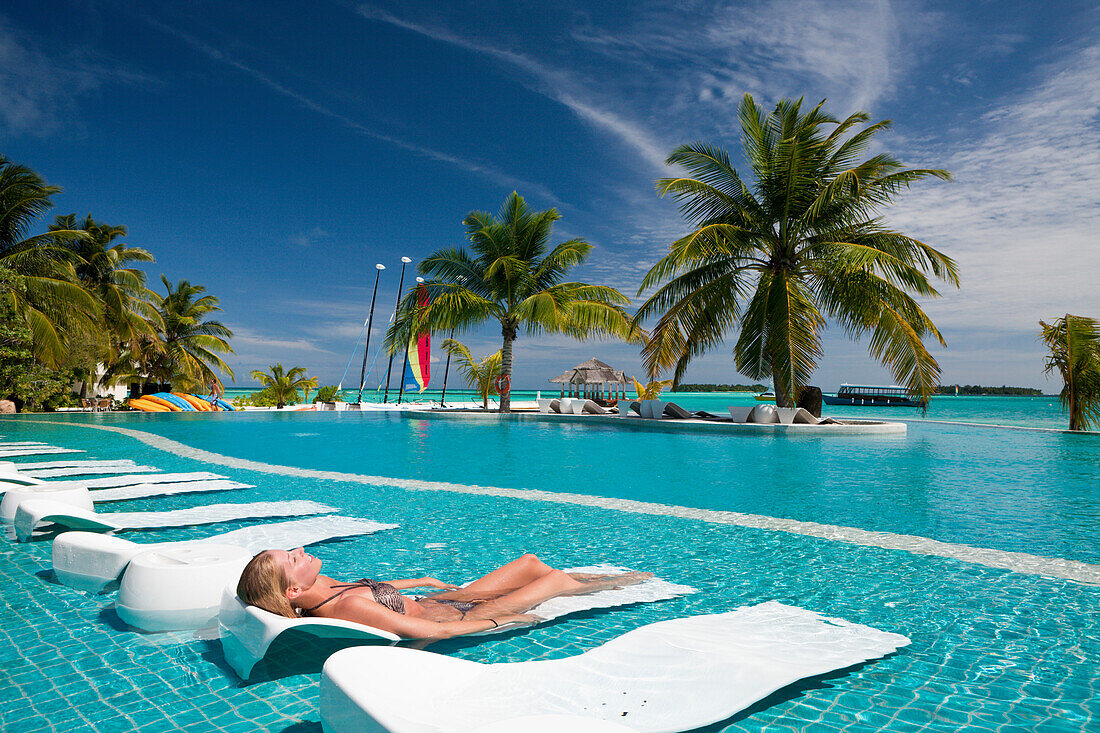 Tourist in Pool of Maldive Island Kandooma, Maldives, South Male Atoll