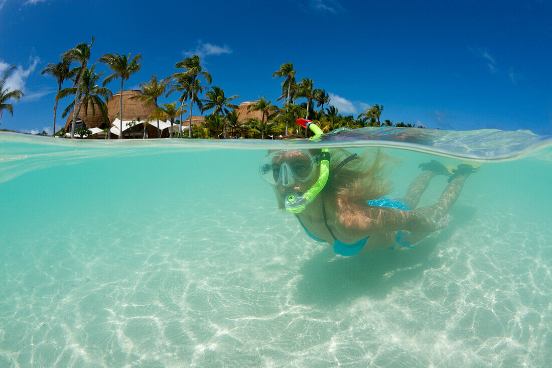 Woman snorkels at Maldives, Maldives, South Male Atoll