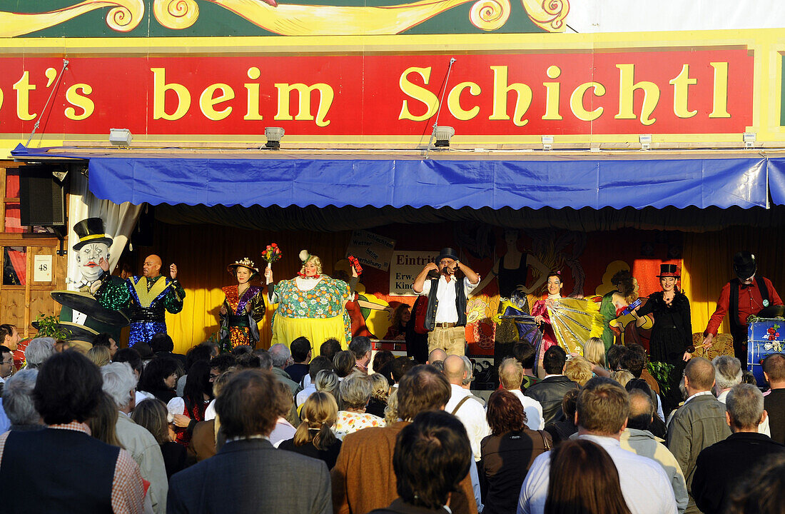 People in front of the show booth at Schichtl, Oktoberfest, Munich, Bavaria, Germany, Europe