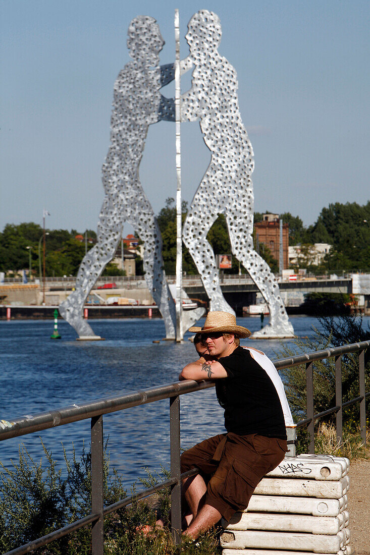 Molecule Man By The American Jonathan Borofsky (1999) Symbolises The Reunion Of The Three Districts, Kreuzeberg (To The North), Friedrichshain (Across) And Treptow, In The Past Separated By The Wall. The Holes That Riddle The Sculpture Reminds Us The 'Man