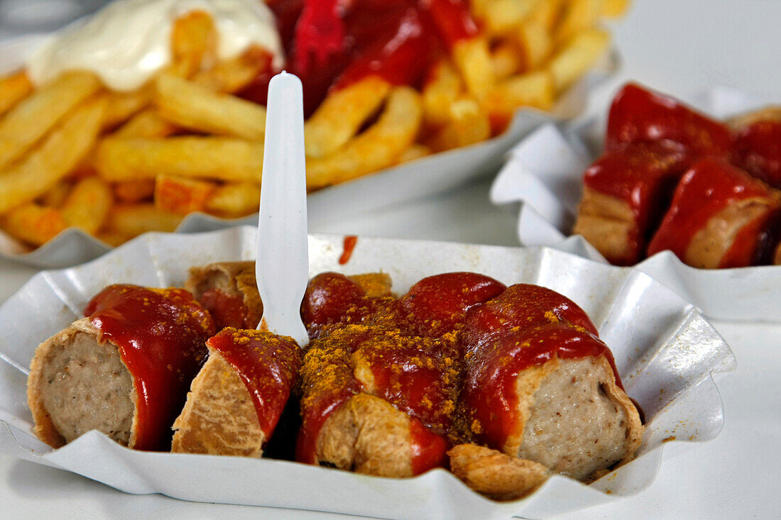Seasoned Currywurst (Sausage In Curry, A Traditional Dish) In Tomato Sauce With Cayenne Pepper And Curry Powder, Berlin, Germany
