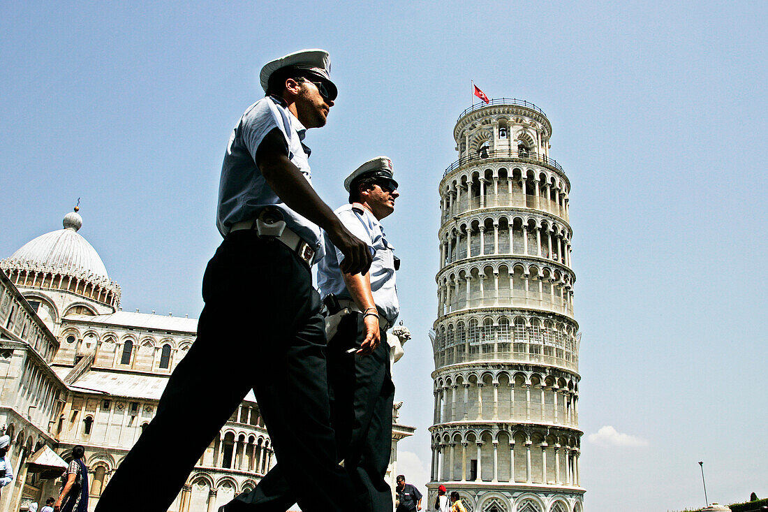 Police Officer (Carabinieri) By The Leaning Tower (Torre Pendente), Baptistery And Cathedral (Duomo) On The Campo Dei Miracoli, Pisa, Tuscany, Italy