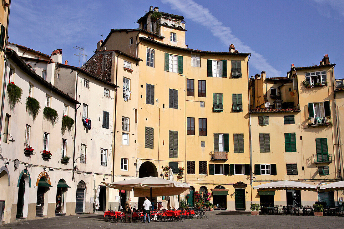 Rounded Houses On The Piazza Del Mercato Or Dell'Anfiteatro, Contours Of The Old Roman Amphitheater, Town Of Lucca, Tuscany, Italy