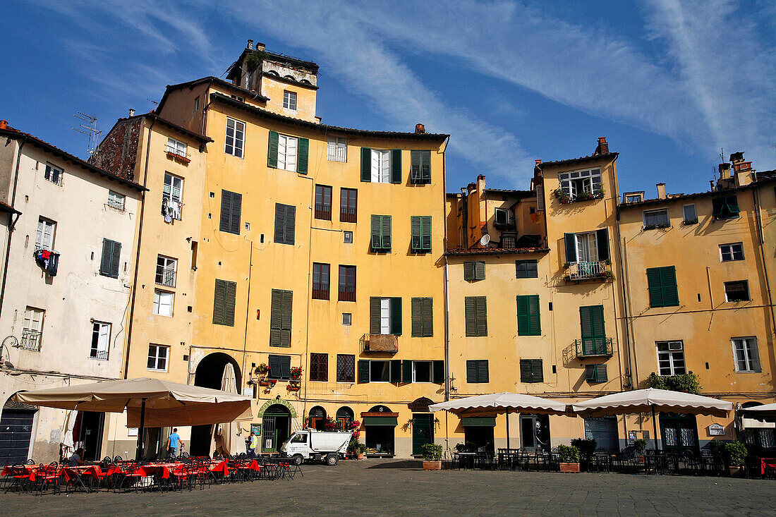 Rounded Houses On The Piazza Del Mercato Or Dell'Anfiteatro, Contours Of The Old Roman Amphitheater, Town Of Lucca, Tuscany, Italy