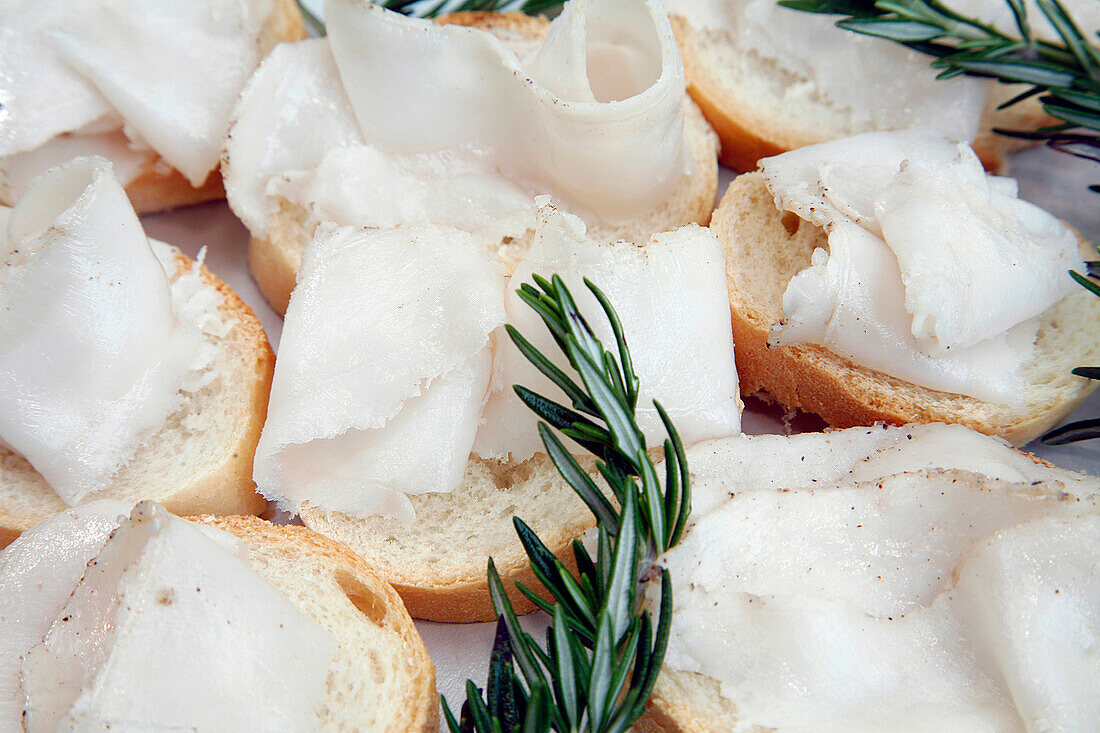 'Lardo Di Colonnata, Colonnata Lard, Coming From A Small Valley Not Far From Carrare. Of A Rectangular Shape (Never Less Than 3 Centimeters Thick), It Is A Lard That Will Marinate In Salt And Spices; The Lower Part Holds The Rind While The Upper Part Is C