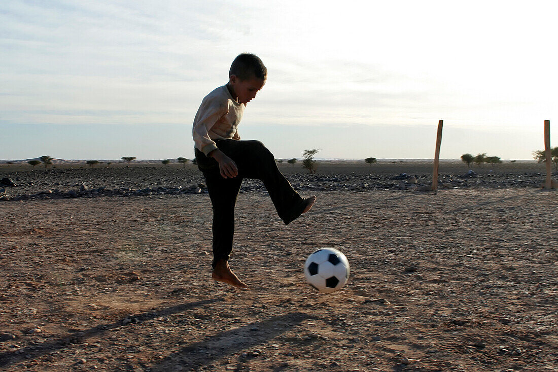 Nomad Child Playing Soccer, Association For The Development Of Nomad Life In The Zagora Region, Berber People, Morocco, Maghrib, North Africa