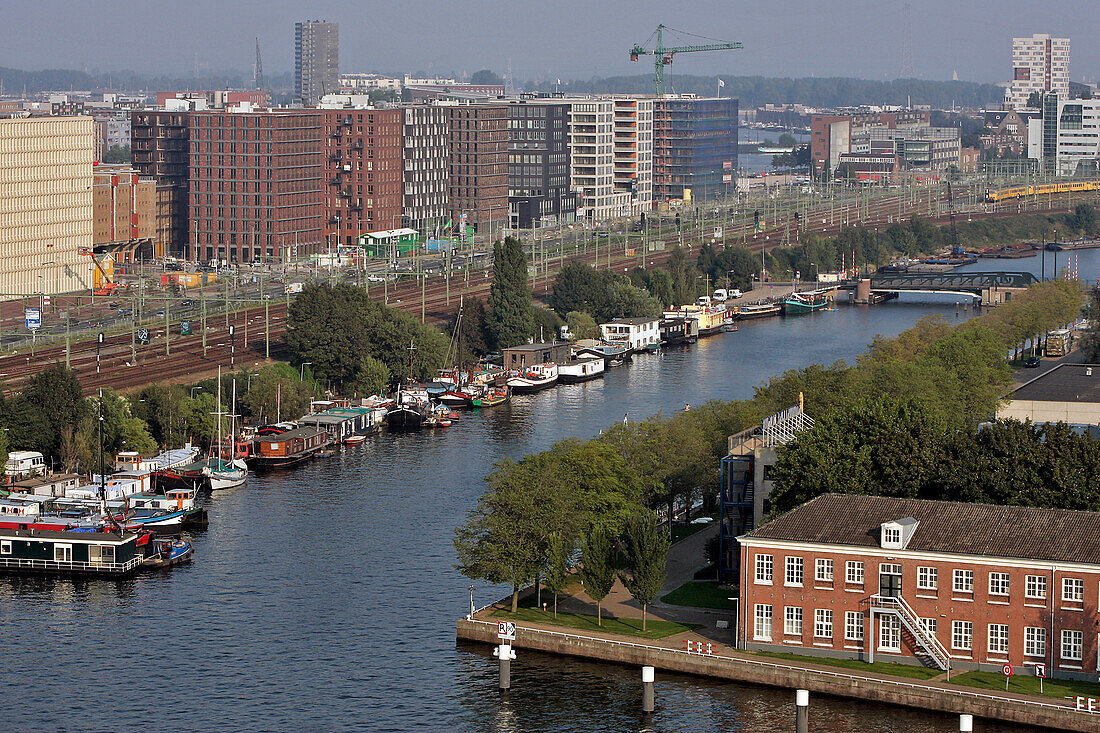 House Boats And Commuter Trains In The Neighbourhood Of The Station, Amsterdam, Netherlands