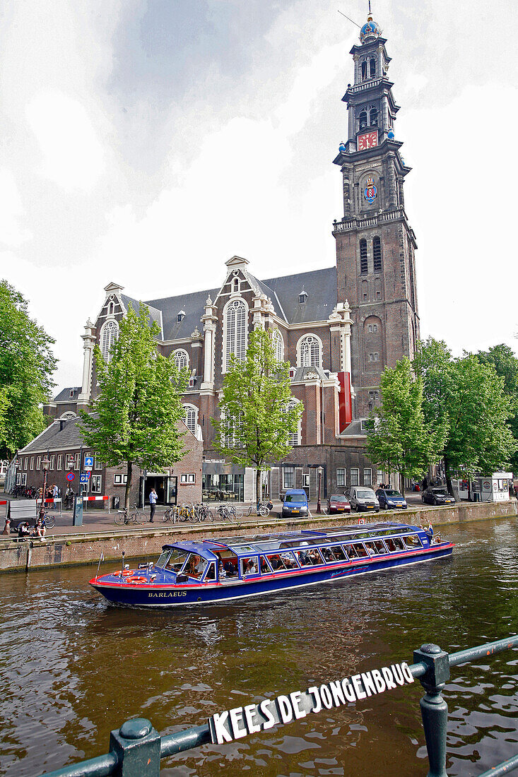 Sightseeing Boat On The Canal Of The 'Kees De Jongenbrug' Bridge And The Westerkerk, The Protestant Church Of Amsterdam