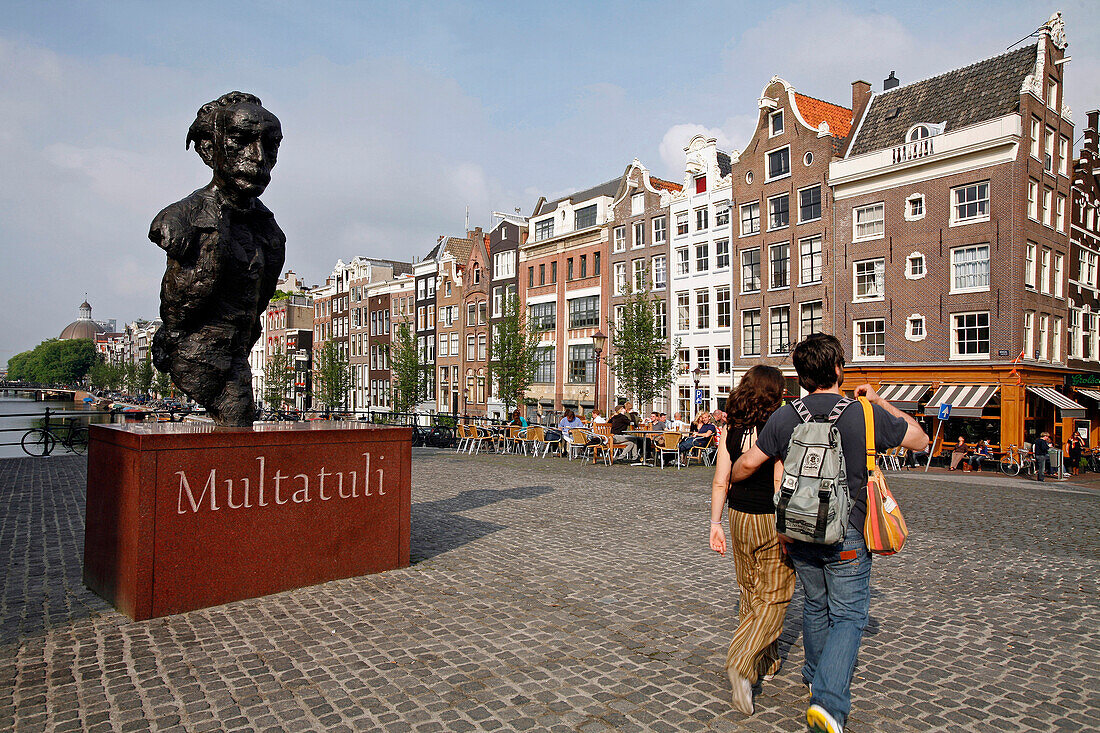 Statue Of Multatuli And Sidewalk Cafe On The Torensluis Bridge