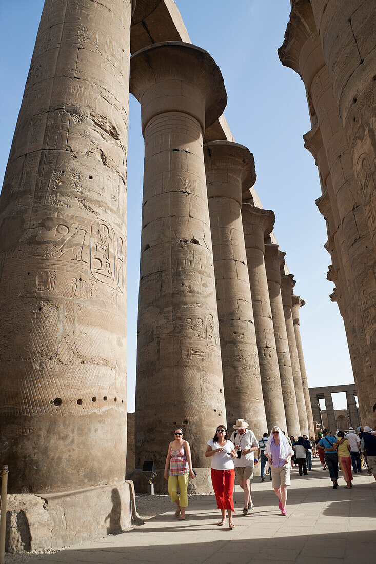 Tourists at Columned Hall inside Luxor Temple, Luxor, Egypt