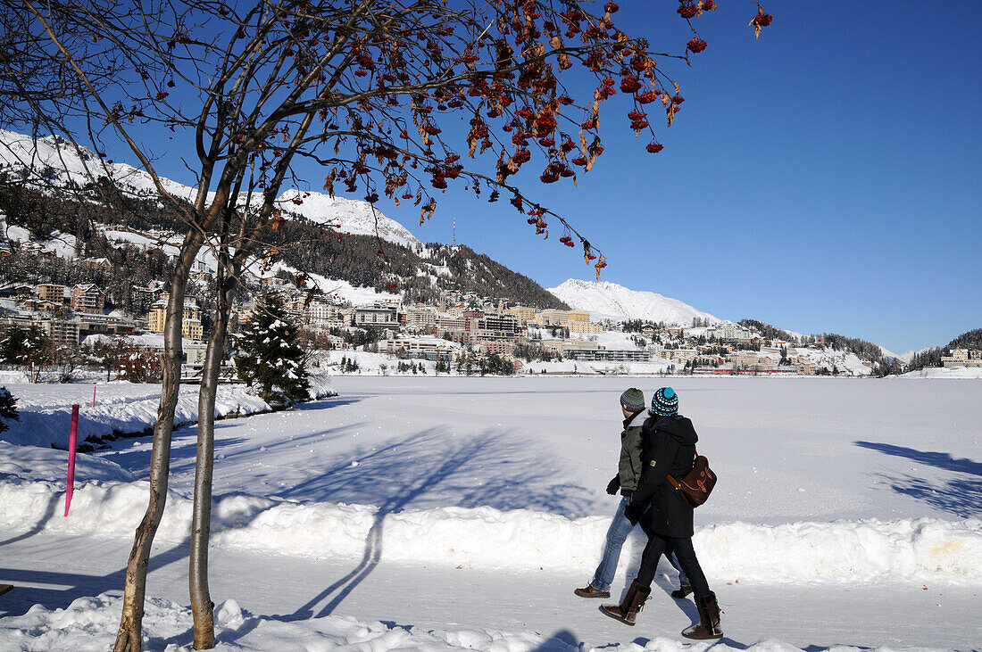 Walkers in snow, St. Moritz, Engadin, Grisons, Switzerland