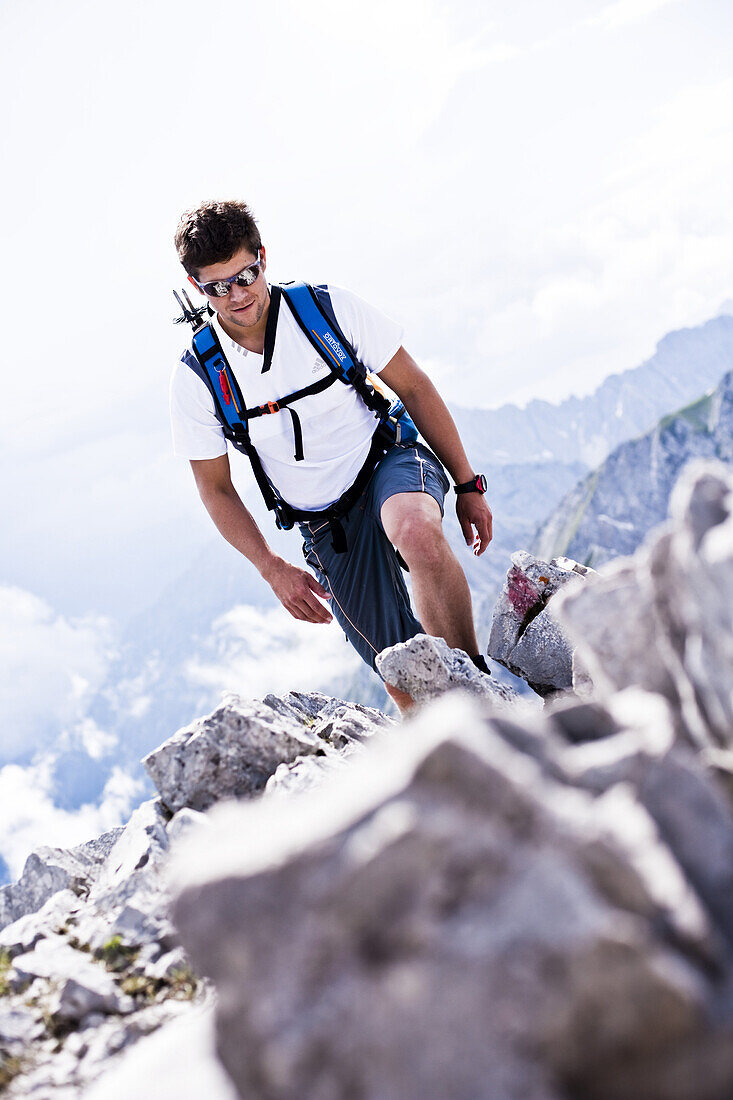 Man hiking on Rumer Spitze, Innsbruck, Karwendel range, Tyrol, Austria